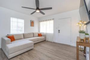 a living room with a couch and a ceiling fan at New Cozy 2BR heart of Tampa in Tampa