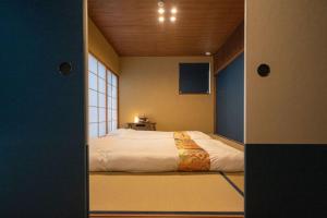 Kama o mga kama sa kuwarto sa 京都松澗Matsutani