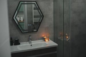 a bathroom with a sink and a mirror at Room&Garden in Mtskheta