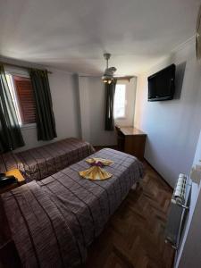 Postel nebo postele na pokoji v ubytování Hotel Bari