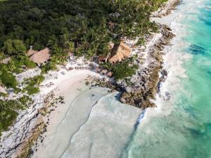 an aerial view of a beach in the ocean at Diamante K - Inside Tulum National Park in Tulum