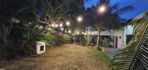a row of lights on a house at night at Vila Boulevard Aconchegante in Manaus
