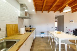 a kitchen with a sink and a counter top at Hotel Rural SOL in Piedrahita de Castro +4 photos