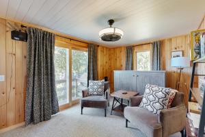 a living room with two chairs and a table at Island House in Hancock