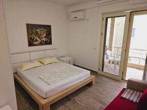 Postel nebo postele na pokoji v ubytování MiniCoco Apartment