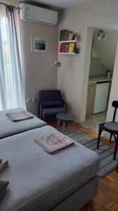 Postel nebo postele na pokoji v ubytování Apartmani Filip