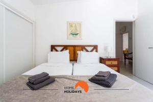 Ένα ή περισσότερα κρεβάτια σε δωμάτιο στο #134 Vila Dias 2 by Home Holidays +37 φωτογραφίες