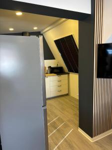 a kitchen with a skylight and a living room at Apartment Ferienwohnung Monteurwohnung Ecke in Magdeburg +20 photos