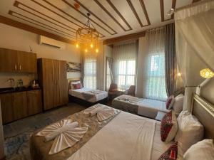 Postel nebo postele na pokoji v ubytování April Hotel