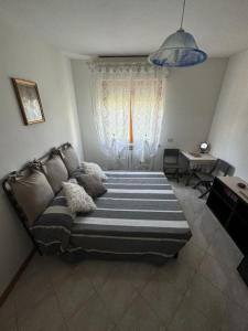 Ένα ή περισσότερα κρεβάτια σε δωμάτιο στο La casa di Mihaela