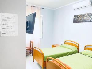 Postel nebo postele na pokoji v ubytování Affitta Camere Mattia Mottola