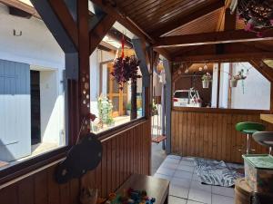 a view of a porch with a building with windows at Sonnenblume Apartment in Oggau