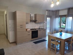 a kitchen with a table and a dining room at A casa di Ester appartamento in Passo Corese +17 photos