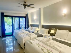 Postel nebo postele na pokoji v ubytování La Palma Suites