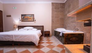 Postel nebo postele na pokoji v ubytování Kallinikos Guesthouse