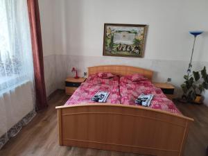 Postel nebo postele na pokoji v ubytování Apartmány u koní