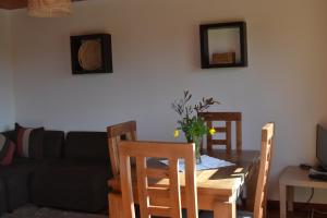 a living room with a table and a couch at Cabañas Boutique il Bosco in Algarrobo