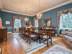 a dining room with a table and chairs at Country Home on Private Estate in Minishant