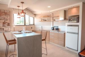 a kitchen with a large island in the middle at Agrelo Vines Lodge in Agrelo