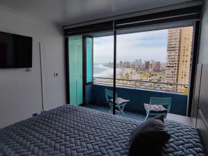 Postel nebo postele na pokoji v ubytování Departamento Iquique vista al mar 1503B