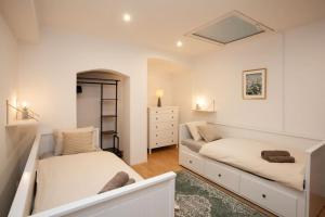 Posteľ alebo postele v izbe v ubytovaní Emerald Apartment