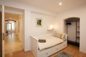 Posteľ alebo postele v izbe v ubytovaní Emerald Apartment