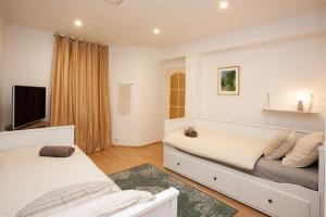 Posteľ alebo postele v izbe v ubytovaní Emerald Apartment