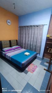 Postel nebo postele na pokoji v ubytování Perhentian Sealife Inn