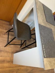 a black chair sitting inside of a box at Ferienwohnung in Korbach in Korbach