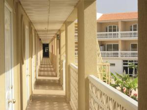 a corridor of a building with white columns and ceilings at Costa del Silencio Studio in Costa Del Silencio