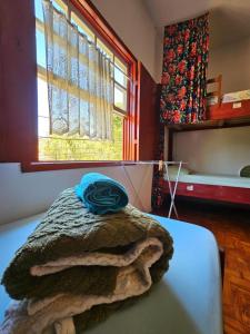 Postel nebo postele na pokoji v ubytování Hostel Lumiar da Serra