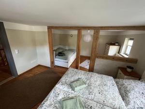a small bedroom with two beds and a mirror at Ferienhaus bei Hempels in Stadt Wehlen