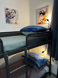 a bunk bed with two pillows on top of it at Intellihost - Casa Giulietta Lonato del Garda in Lonato