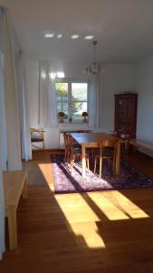 a dining room with a wooden table and chairs at U Janciów in Krakow