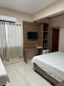 Postel nebo postele na pokoji v ubytování Hotel Alibertti