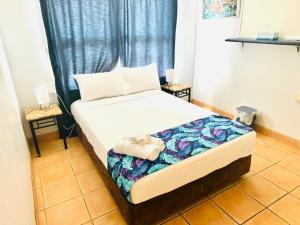 Postel nebo postele na pokoji v ubytování Motel Ingham