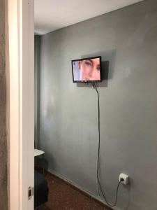 a flat screen tv hanging on a wall at Nueva 6 in Algeciras