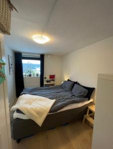 En eller flere senge i et værelse på Villa Tara