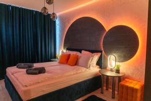 a bedroom with a large bed and a table at Balkan tower-Rest in Gabrovo