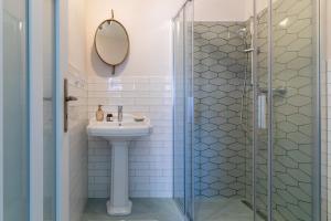 a bathroom with a sink and a shower at ARANYPATKÓ Vendégház in Aggtelek