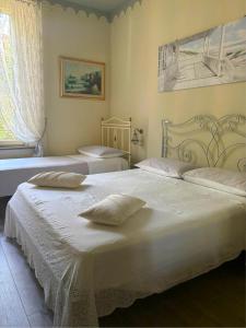Postel nebo postele na pokoji v ubytování Villa Gemma Rorò