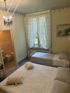 Postel nebo postele na pokoji v ubytování Villa Gemma Rorò
