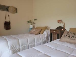 Ένα ή περισσότερα κρεβάτια σε δωμάτιο στο La Arbolada Casa Quinta