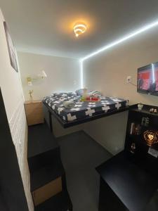 Et tv og/eller underholdning på Confortável loft 4,ar, Wi-Fi, TV, 400m UNIG + 54 billeder