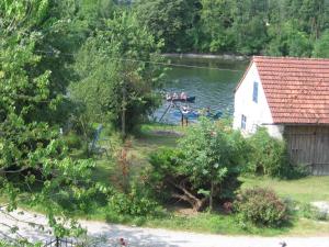 a group of people in a boat on a lake at Ferienhaus am Lech in Kaufering +6 photos