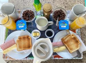 a tray of breakfast foods with toast and eggs at Nido de Cóndores in Santiago