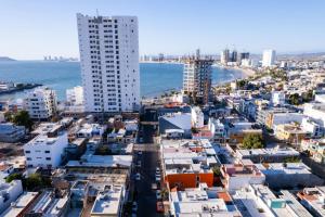 an aerial view of a city with buildings and the ocean at Remodeled Cozy Central 3 blocks from the Malecon in Mazatlán