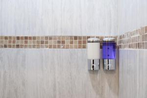 two lights on a wall in a bathroom at Remodeled Cozy Central 3 blocks from the Malecon in Mazatlán +40 photos