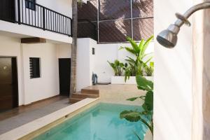 a swimming pool in the middle of a house at Relaxed Centrally Located 2BR 1BA Ideal Workspace in Mazatlán
