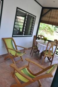 a dining room with a table and chairs at La Bel Zilwaz Guesthouse in La Digue